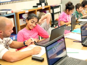 teacher helping student with homework