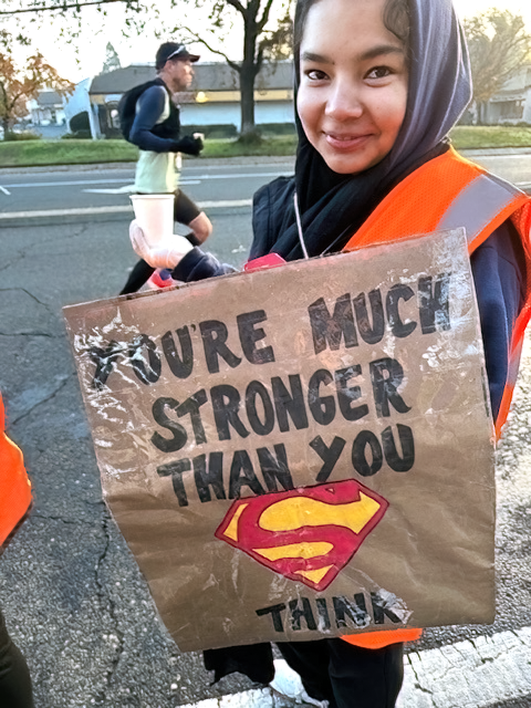 student holding sign 