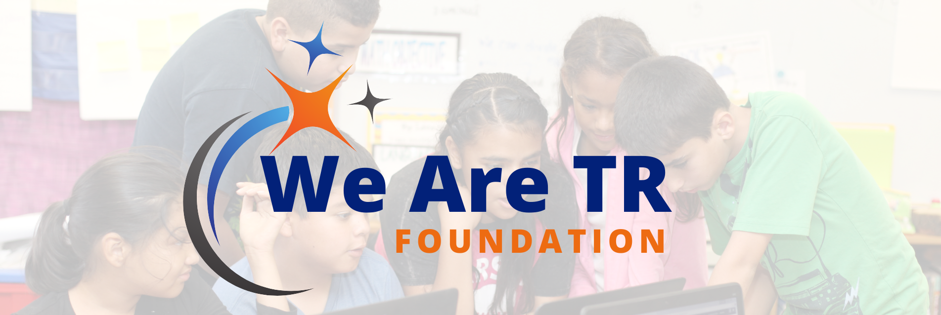 we are tr foundation logo with students looking around a computer