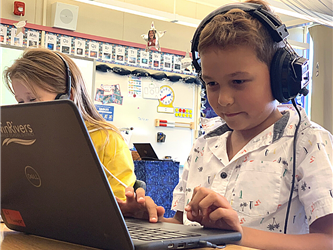 male student on laptop computer