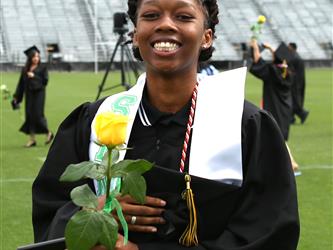 High school graduate smiling.