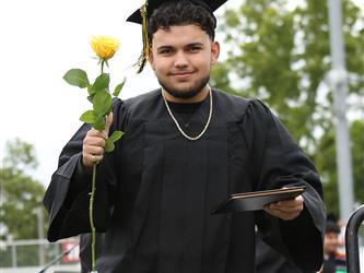 High school graduate smiling