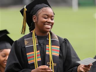 High school graduate smiling.