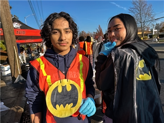 two students wearing batman outfits