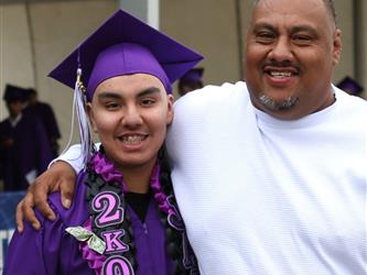high school graduate witht father.