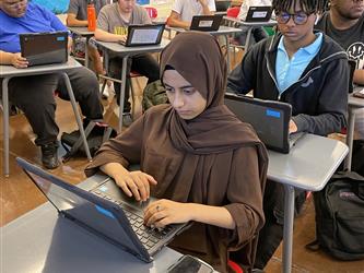 student working on laptop
