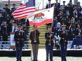 JROTC students presenting the american and california flags.