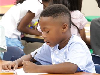 student working in book