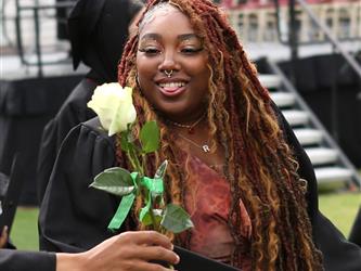 High school graduate smiling.