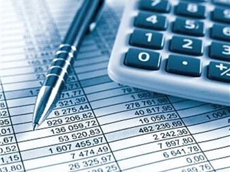 calculator mechanical pencil and budget sheet