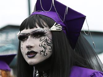 high school graduate with lots of makeup on.