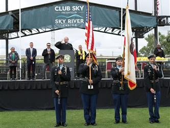 JROTC honor guard presenting the American and California flags.