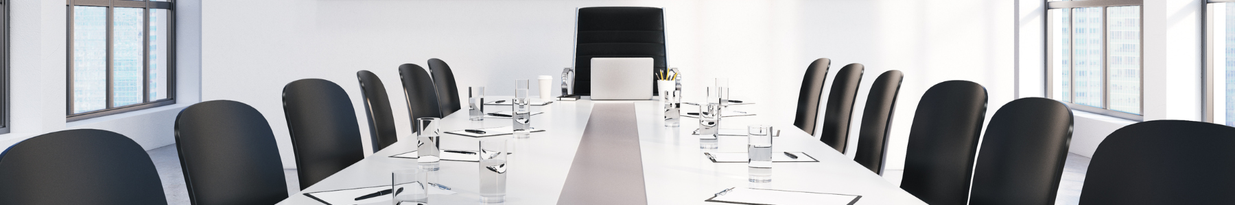 negotiation table chairs glasses of water pen and papers