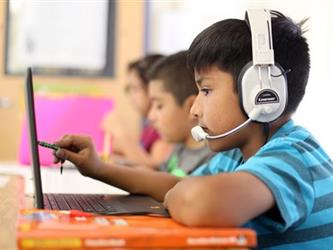 boy with headphones and laptop