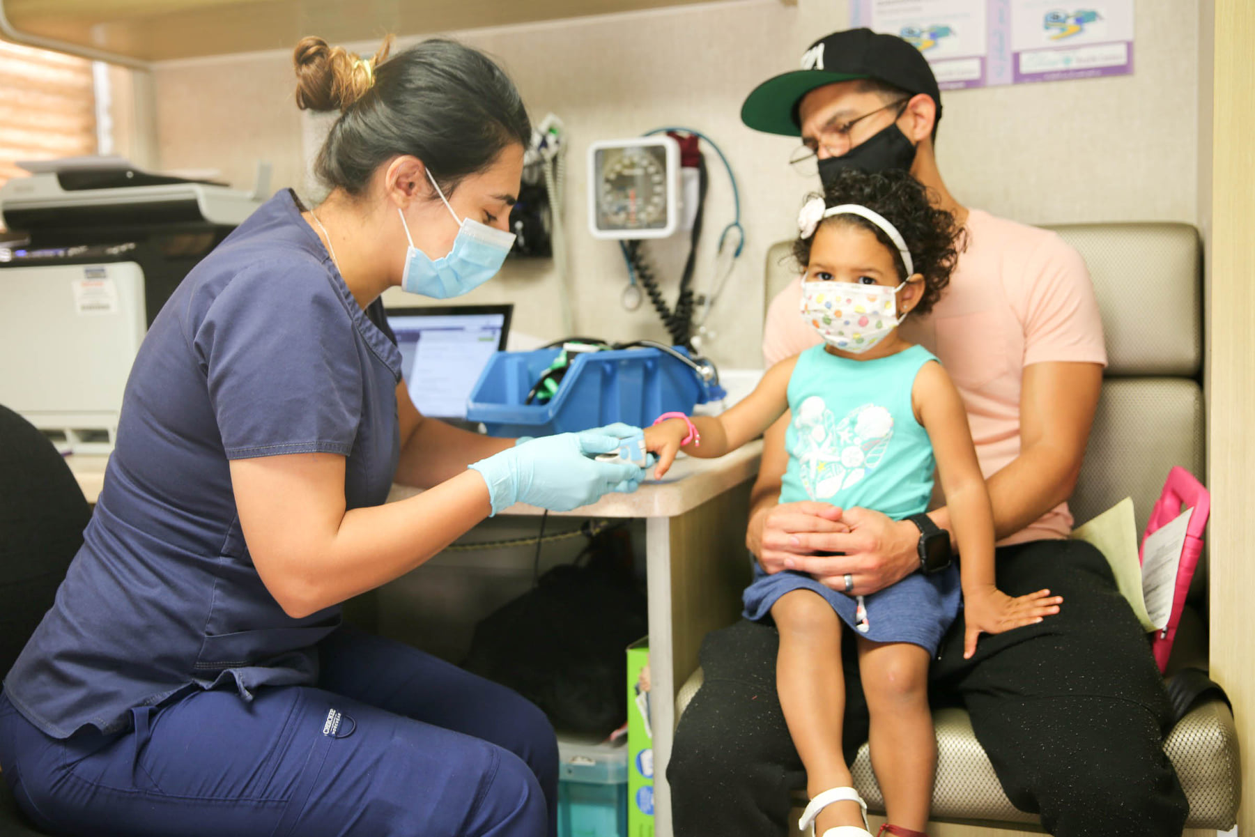child receiving medical checkup