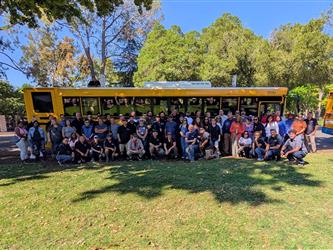 Transportation Staff in front of a school bus