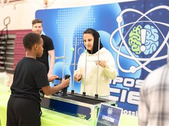 Students participating in a science exhibit