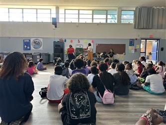 Students listening to the speaker.
