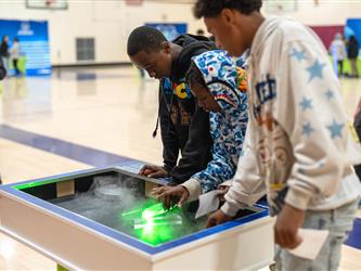 Students participating in a science exhibit