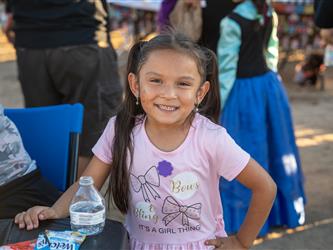 Student smiling at the camera
