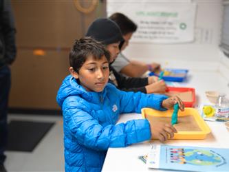 Students engaging in a science project building activity